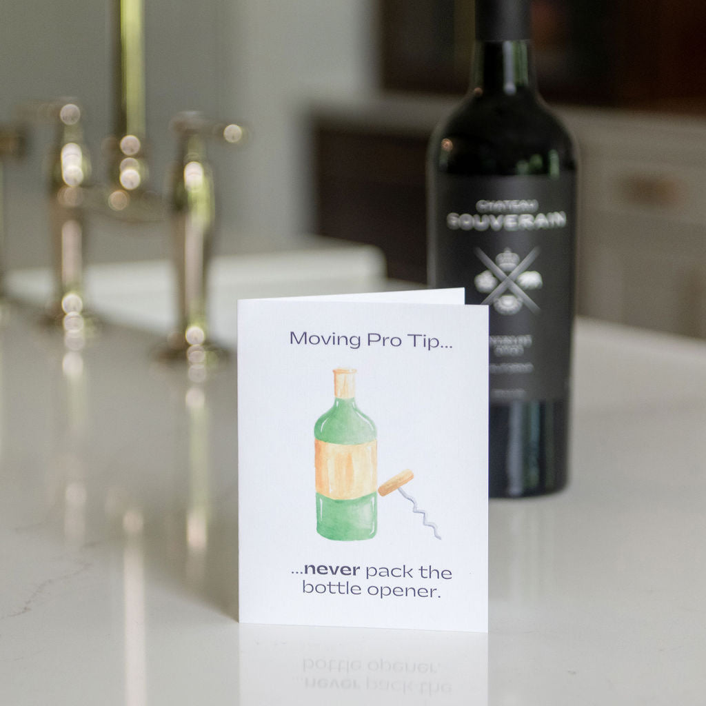 Card with a bottle opener illustration on a kitchen counter with a bottle and faucet in the background