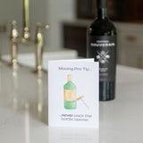 Card with a bottle opener illustration on a kitchen counter with a bottle and faucet in the background