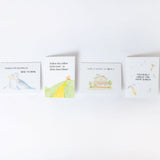 Four greeting cards with hand drawn illustrations for moving and real estate laying on a white background