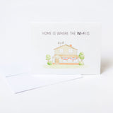 Greeting card with house illustration and text 'Home is where the Wi-Fi is' on a white background