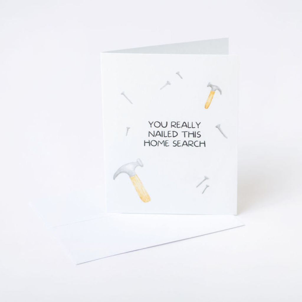 Greeting card for homebuyers with hammer and nail illustrations and text on a white background