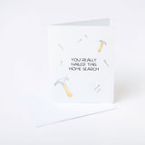 Greeting card for homebuyers with hammer and nail illustrations and text on a white background