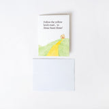 Greeting card with a yellow brick road illustration and text on a white background