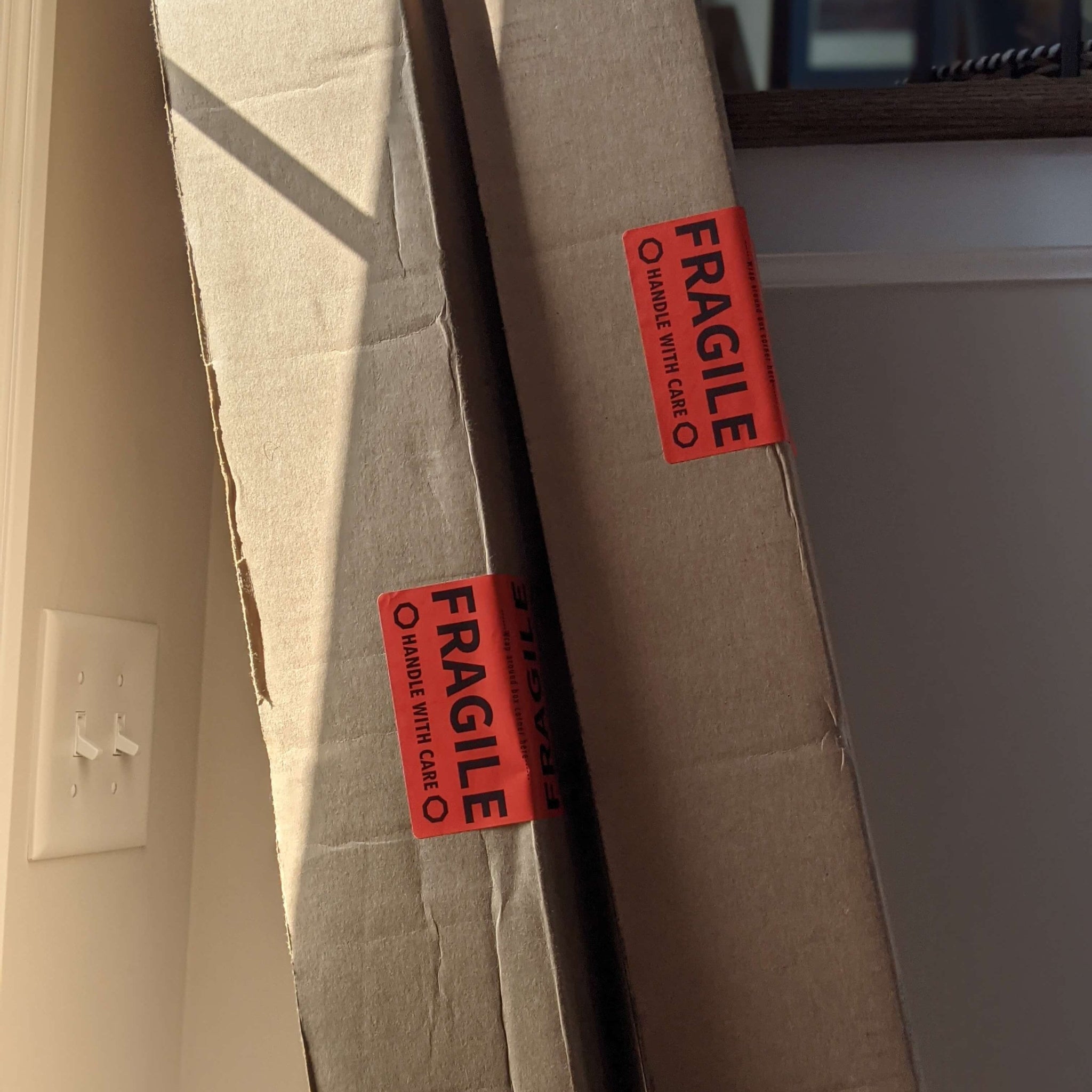 cardboard moving boxes with fragile stickers
