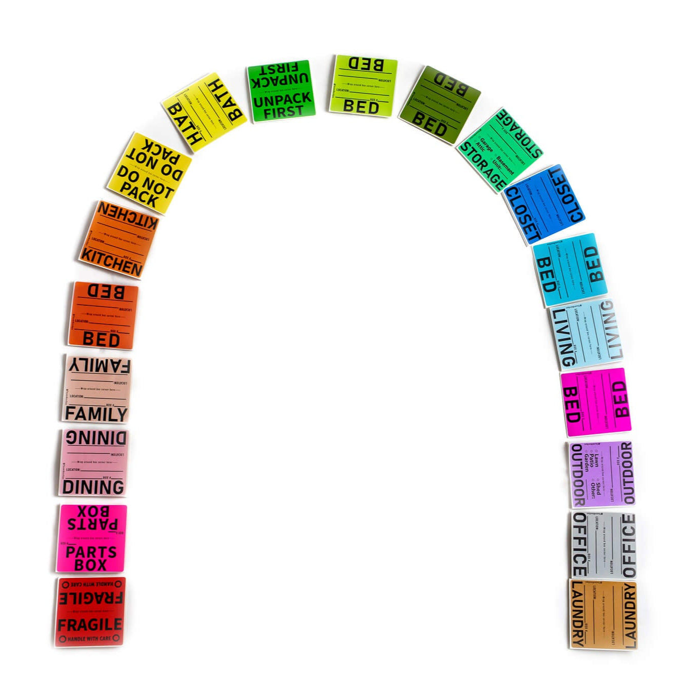 An arch arrangement of various colored moving box labels and room signs, with labels text including 'BED', 'KITCHEN', 'FAMILY', 'DINING', 'OFFICE', 'FRAGILE'.