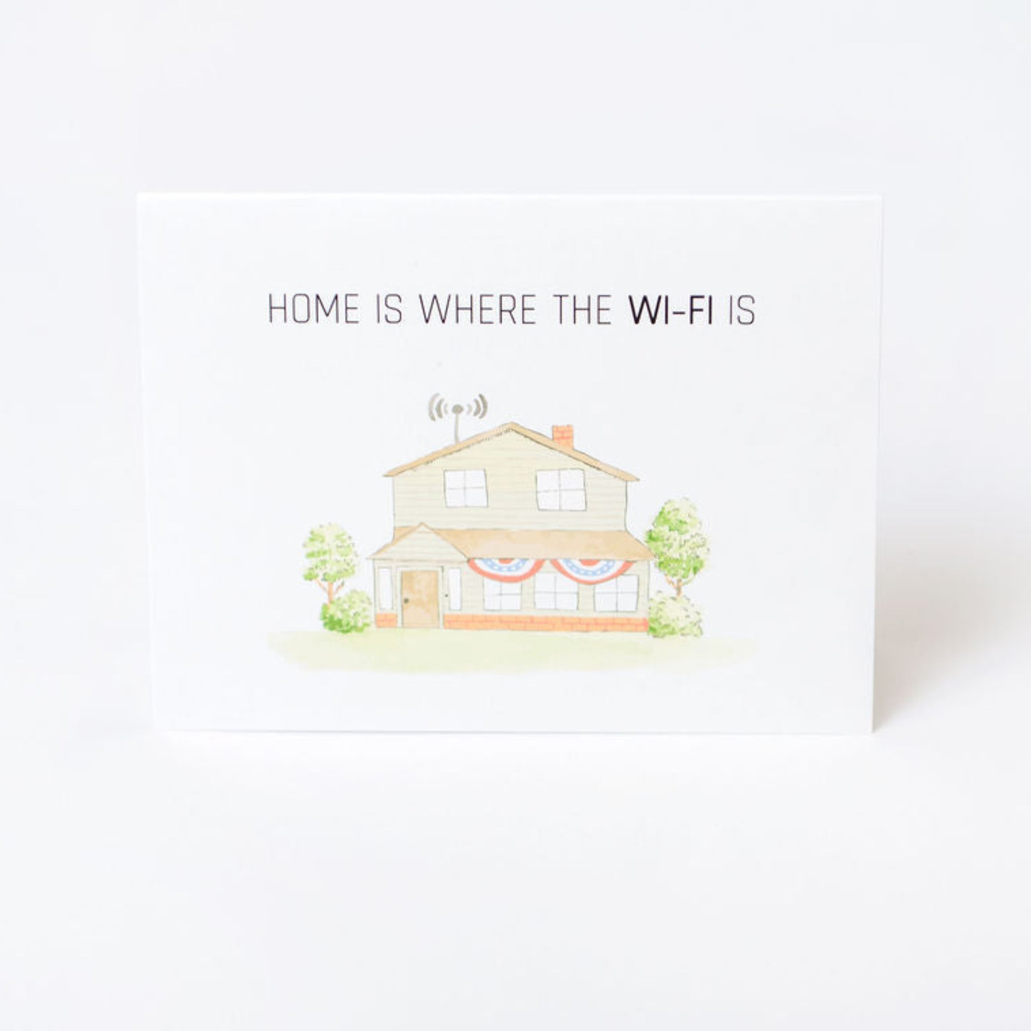 Greeting card with illustration of a home and text reading "home is where the WIFI is" on a white background