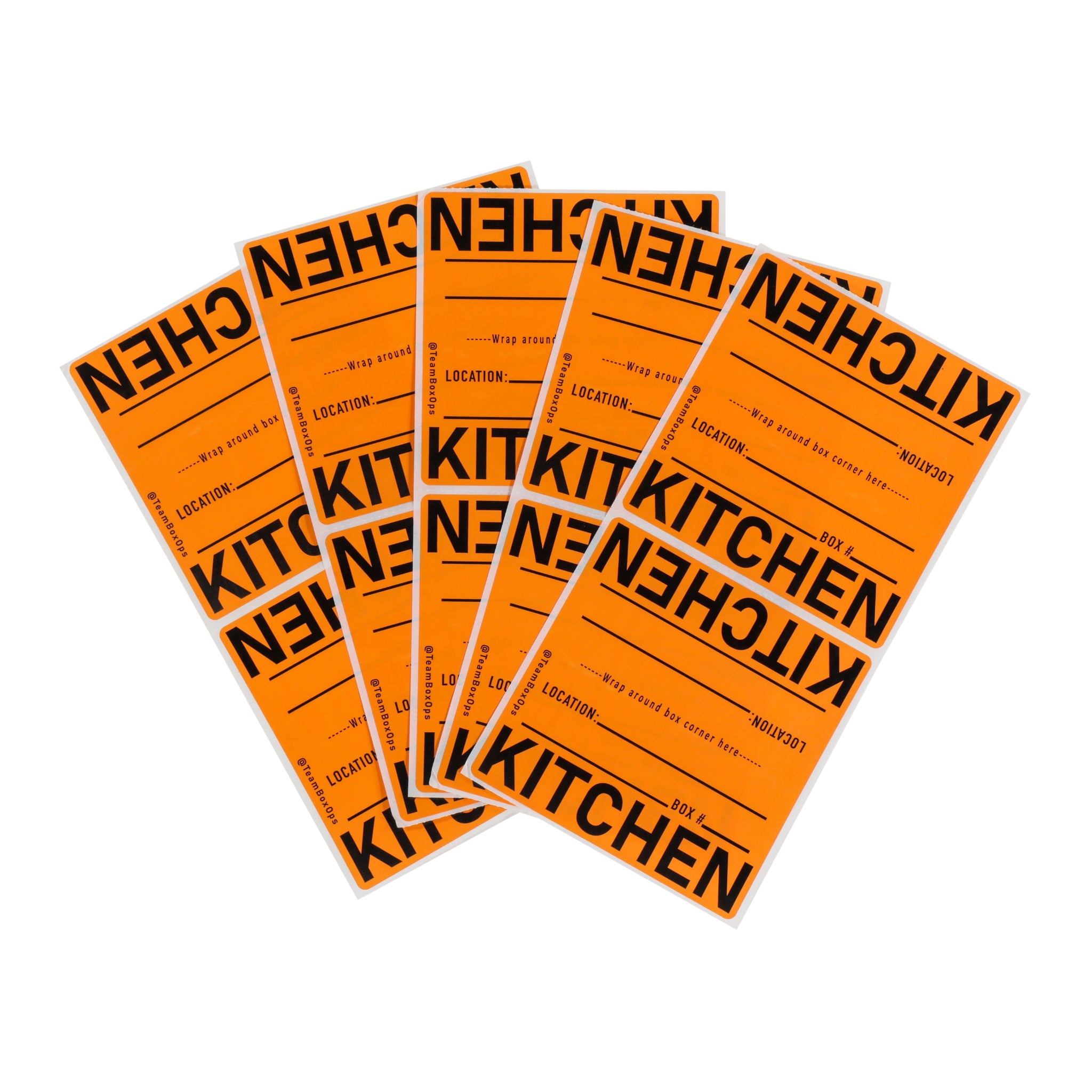 Multiple orange moving box labels with 'KITCHEN' printed on them against a white background