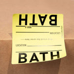 Yellow label with 'BATH' text on a cardboard box